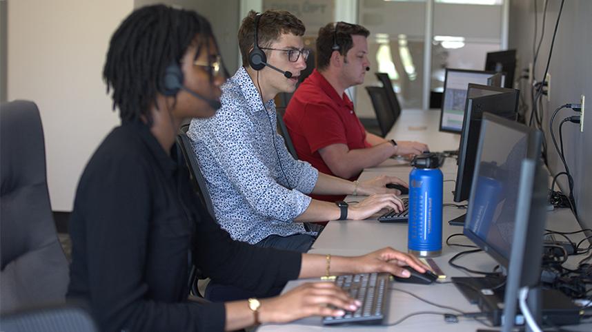 Cedarville students working in the pharmacy call center 858